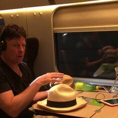 Claude with Augustin on train in Italy, 2015